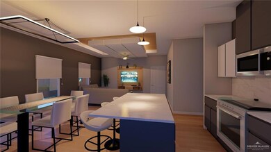 Kitchen featuring tasteful backsplash, decorative light fixtures, stainless steel microwave, electric stove, and light wood-style floors