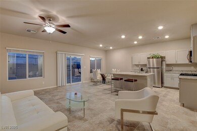 Living room with baseboards, a ceiling fan, visible vents, and recessed lighting
