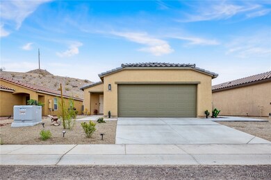 View of front of home with stucco siding, concrete