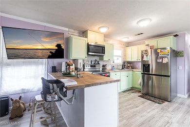 Kitchen with appliances with stainless steel finis