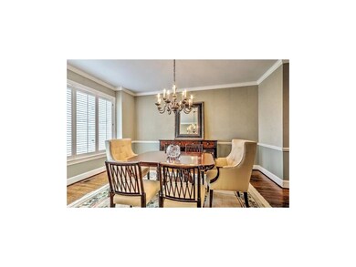 Spacious dining room with plantation shutters