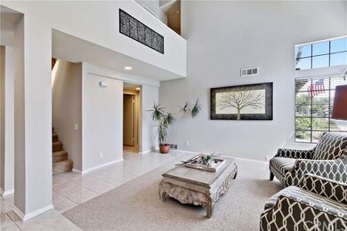 Open 2 story living room with plenty of light