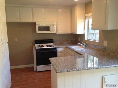 Renovated kitchen with granite slab counters, gas 