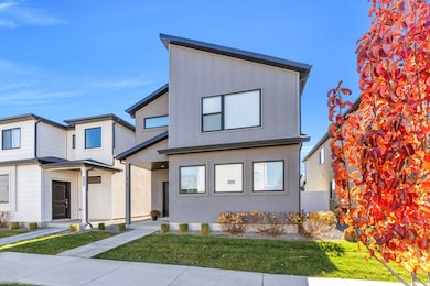 View of front of house featuring a front yard and stucco siding