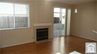 Living & Dining room with fireplace and sliding gl