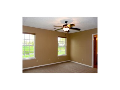 Master Bedroom looks out at ponds, new carpet.