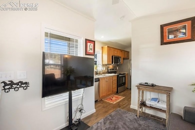 Kitchen featuring visible vents, dark wood-type fl
