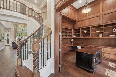 Office area featuring dark wood-style flooring, bu