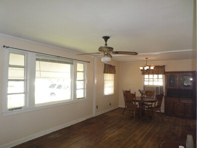 Open Living and Dining Room With Hardwood Floors