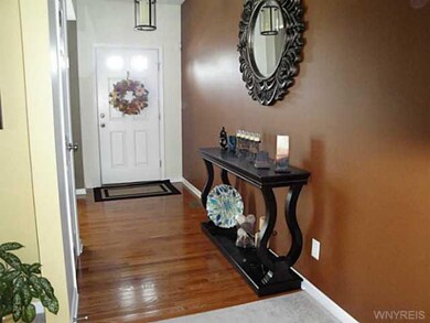 Foyer Gleaming Hardwood Floors Welcome You