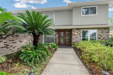 Lush gardens line the entry way.