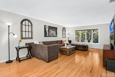 Large living room spans from the front to the back of the house. The bow window overlooks the front yard.