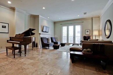 Fireplace in living area and flat screen.