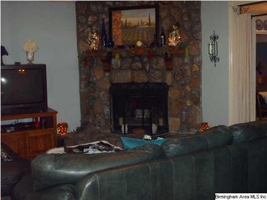 Beautiful stone fireplace in the family room.  Gas