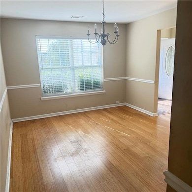 Unfurnished dining area with light wood finished f