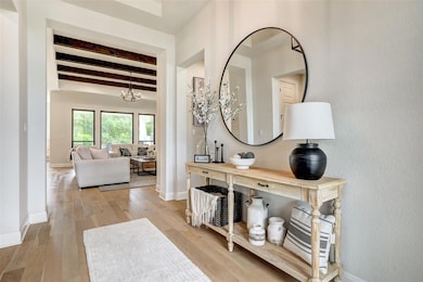 Hall featuring beamed ceiling and hardwood / wood