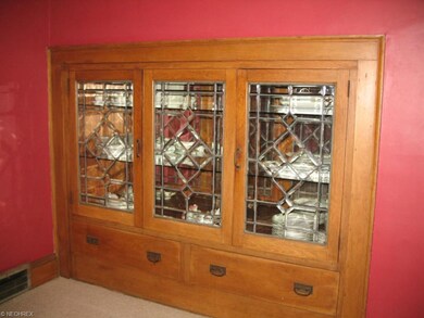 Large dining room with built in china cabinet.