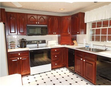 Kitchen. The 15x9 kitchen has newer cherry cabinet