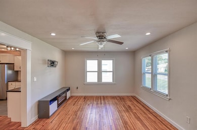 Spare room featuring light hardwood / wood-style f