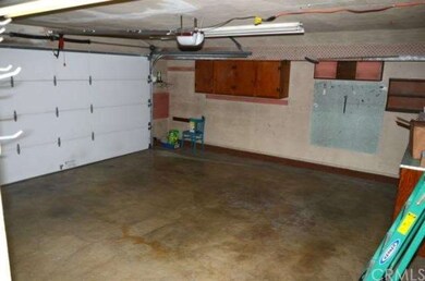 Direct access to garage with roll-up door and open