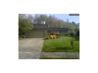 Manicured lawn and professional landscaping.