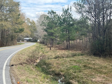 Osyka Progress Rd with property on the right