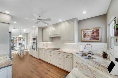 Custom range hood, stone counters and all the extras