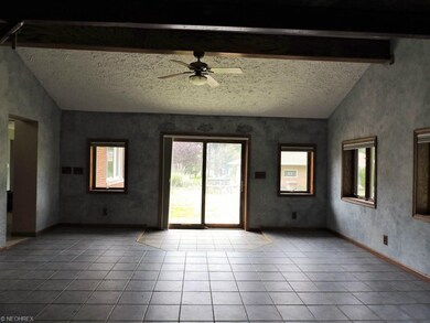 Great room with vaulted/beamed ceilings, radiant h