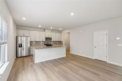 Kitchen featuring appliances with stainless steel 