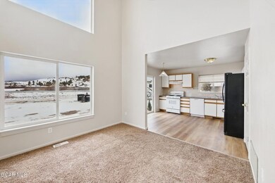 Unfurnished living room featuring visible vents, b