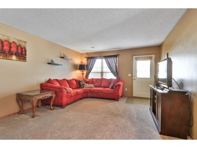 Living room is ample size and could accommodate a 