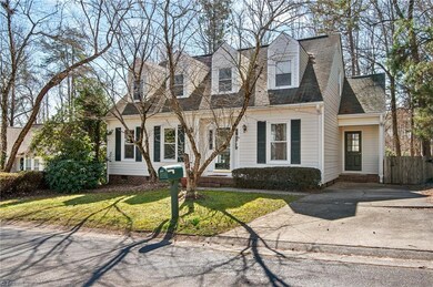 Adorable Cape Cod with side yard parking & entrance to a laundry/mud room.