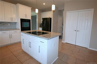 Kitchen island with smooth top cook top