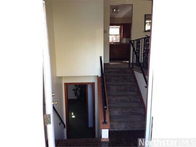 Down the stairs is the family room door way