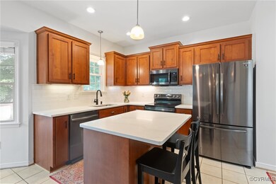 Kitchen featuring stainless steel appliances, a si