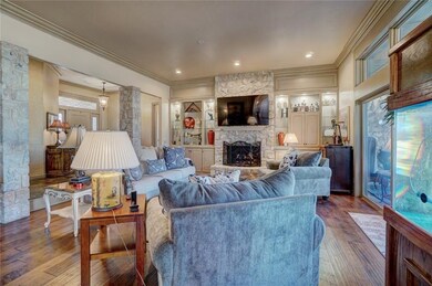 Living room with fireplace & built ins with oversi