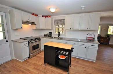 New kitchen - cabinets, granite counter tops, laminate flooring and appliances