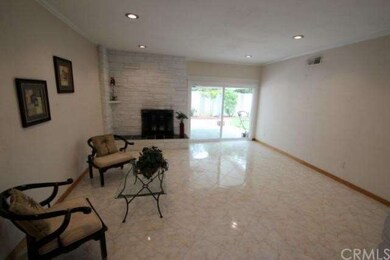 Floor to ceiling stone raised hearth fireplace.