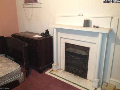 1 of two fireplaces in the home. This one is in the master bedroom with its original insert!