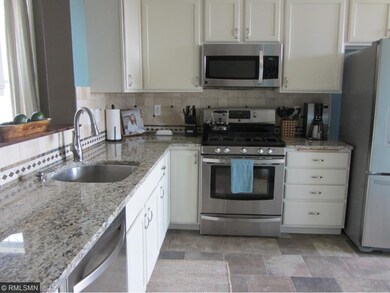 Newly updated kitchen with gleaming granite counte