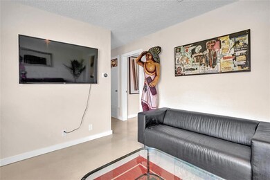 Living area with finished concrete floors, a text