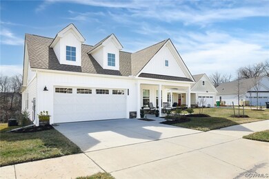 View of front of property featuring a front lawn,
