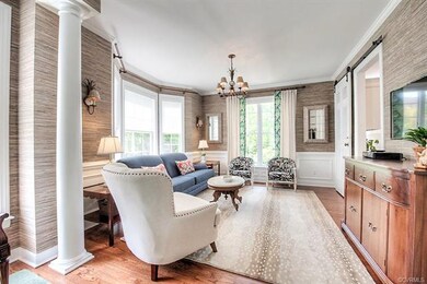Living Room with bay windows and barn door separat