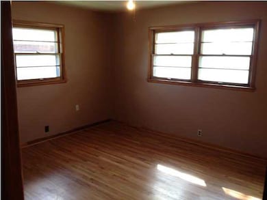 Master bedroom with lots of windows for light