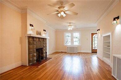 Warm and welcoming fireplace anchors the large bri