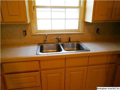 Updated tile countertops and back splash.