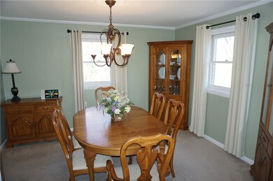 The Dining room is accented with crown moulding an