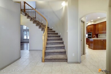 Entry w/dramatic curved staircase