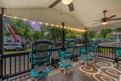 Wooden terrace featuring ceiling fan