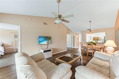 Living area with high vaulted ceiling, ceiling fan